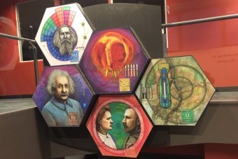 Several of the artworks depict famous figures in science, including Einstein, Mendeleev, and Marie and Pierre Curie